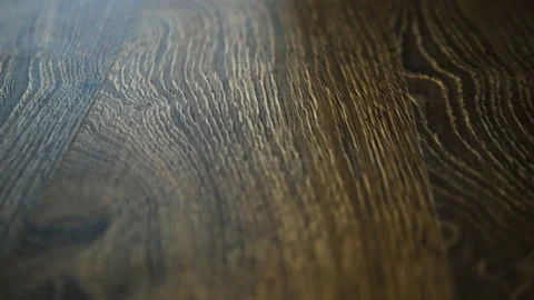 Camera slide on parquet board, laminate close-up, walnut laminate floor. Stock Footage 153751092