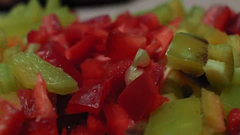 Camera slide on small pieces of red and green paprika Stock Footage 140746984