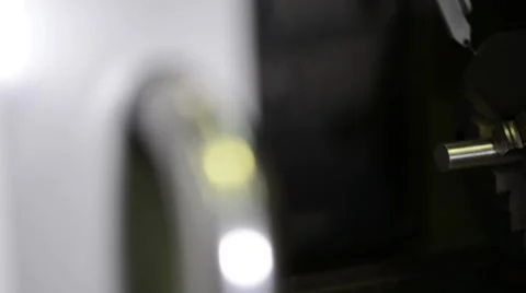 Camera slides inserting to frame cnc machine three jaw chuck with metal detail Stock Footage 48991073