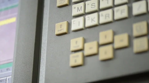 Camera slides over control panel and display monitor with CNC machine parameters Stock Footage 49009887