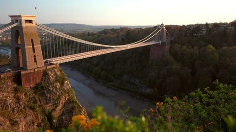 Camera slides over hedgerow with the Clifton Suspension Bridge Stock Footage 89825503