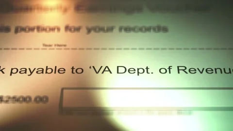 Camera Slides over Payment Voucher to the Virginia Department of Revenue Stock Footage 266716315