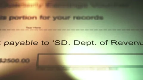 Camera Slides over Payment Voucher to the South Dakota Department of Revenue Stock Footage 267397225