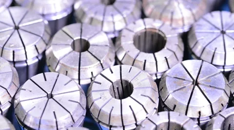 Camera sliding over CNC milling machine metal collets with changing light Stock Footage 49006087