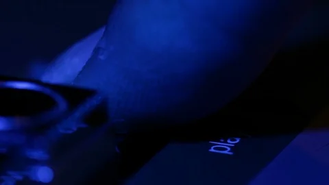 Camera sliding over retro cassette music player buttons, finger pushing play Video stock 88914873