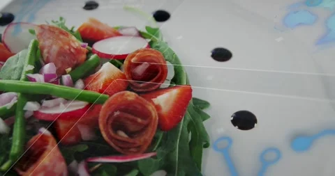 Camera sliding rightward, plated salad revealing rosettes and textures for menu Stock Footage 323371118