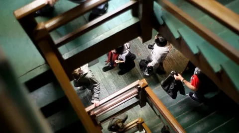 Camera Slow Pan Down Old Staircase with People Walking Vídeos de archivo 10755167