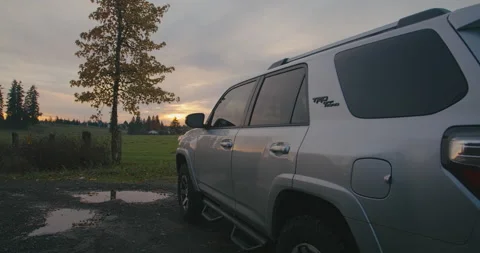 Camera slow pan Sunset behind car 4runner Stock Footage 144209949