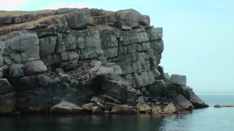 The camera slowly moves along one of the capes of Snake Island, the coast is Video stock 242163897