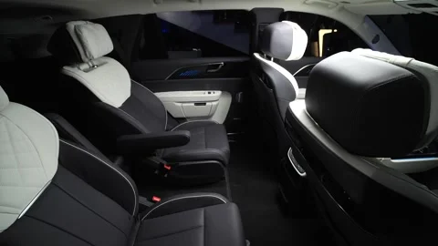 The camera slowly moves around the black interior of a premium car.  Stock Footage 272786661