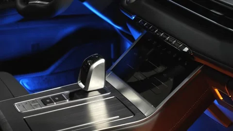 The camera slowly moves around the interior of a new car in a dark studio Stock Footage 280543368