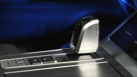 The camera slowly moves around the interior of a new car in a dark studio Stock Footage 280543369