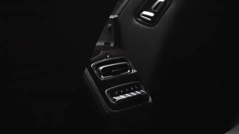 The camera slowly moves around the interior of a new car in a dark studio Stock Footage 280552688