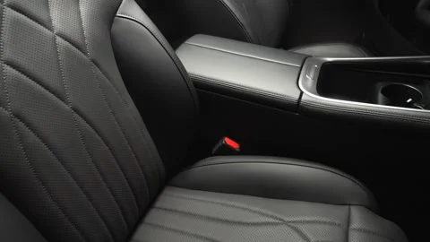 The camera slowly moves around the interior of a new car in a dark studio Stock Footage 280552689