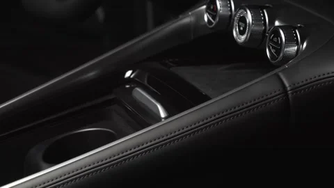 The camera slowly moves around the interior of a new car in a dark studio Stock Footage 280552690