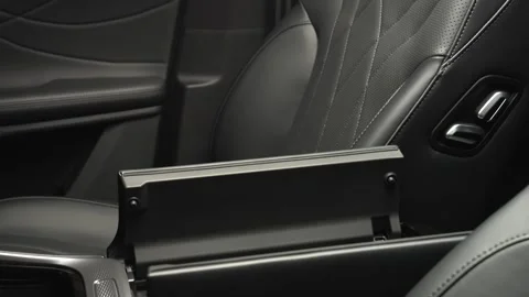 The camera slowly moves around the interior of a new car in a dark studio Stock Footage 280552710