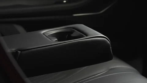 The camera slowly moves around the interior of a new car in a dark studio Stock Footage 280552713