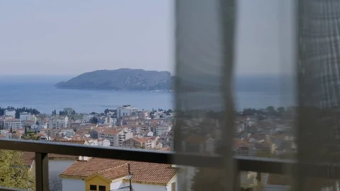 Camera slowly moves on Beautiful view of the city of Budva on a sunny day Vídeo Stock 129611700