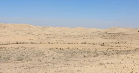 Camera slowly moves from left to right on hills in desert Stock Footage 116795383