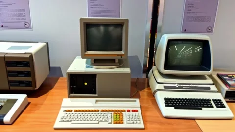 Camera slowly panning across a collection of obsolete computers from the Stock Footage 347706929