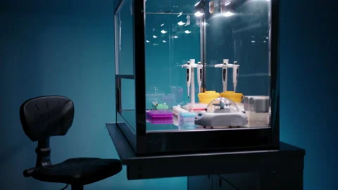 Camera slowly panning around a PCR cabinet with sample tubes and a centrifuge Video stock 236465334