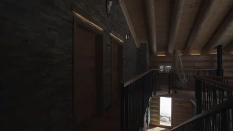 Camera slowly panning inside a luxurious and rustic mountain log cabin with Stock Footage 335757053
