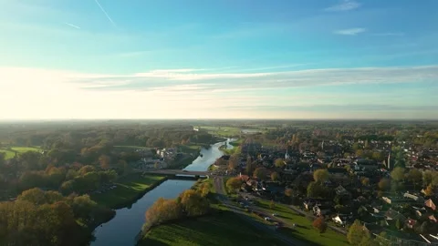 Camera slowly panning over small town with river Stock Footage 293158005