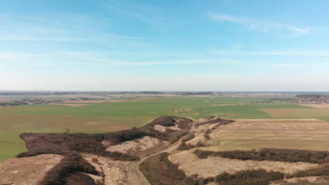Camera slowly ridesdown to a field of a farm. Stock Footage 88454712