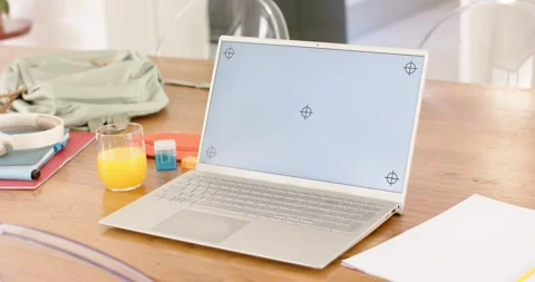 Camera is slowly zooming and shifting, showcasing silver laptop with crosshair Stock Footage 339559010
