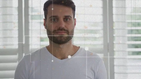 Camera slowly zooming as man standing centered before shutters, grid lines Stock Footage 333903238