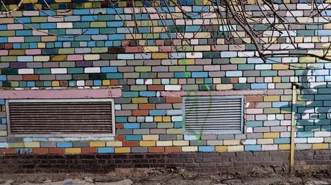 The camera is smoothly attached to the brick wall Stock Footage 126170087