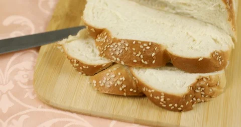 The camera smoothly moves forward over the sliced challah for Shabbat Stock Footage 117202711