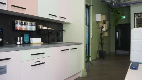 Camera span across a modern open living space with kitchen. Stock Footage 241314029