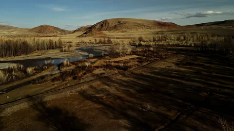 Camera span at low altitude. Landscape from the western. Bare trees without Stock Footage 196059707