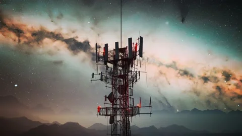 Camera spin around an antenna complex on a hill. Starry night in the mountains. Stock Footage 201124914