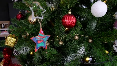 Camera spinning around Christmas tree showing decorations and ornaments Stock Footage 140473622