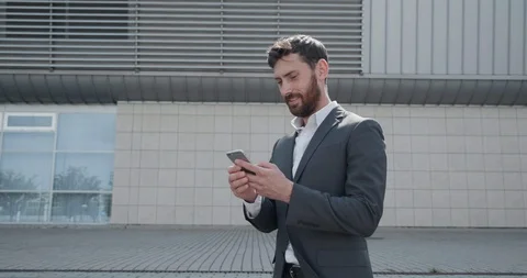 Camera spinning around a concentrated Man Dressed in Business suit. Stock Footage 125153268
