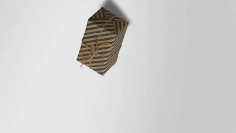 Camera spinning. Gift wrapped in old paper. New Year's gift box. Conscious  Stock Footage 142138646
