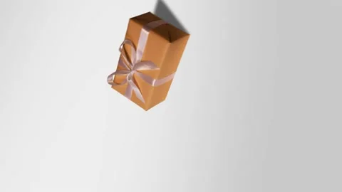 Camera spinning. Orange gift with a white ribbon on a white background. New Year Stock Footage 142138645