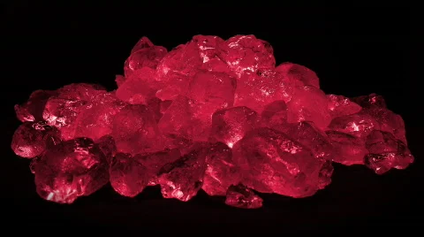 The camera spins around this pile of odd coloured ice as it's melts in time-laps Video stock 376357