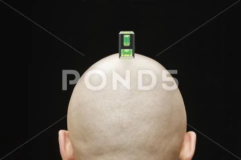 A Camera Spirit Level On The Head Of A Man, Rear View