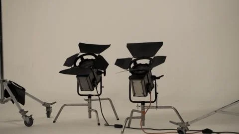 Camera spotlight in big studio. Stock Photos