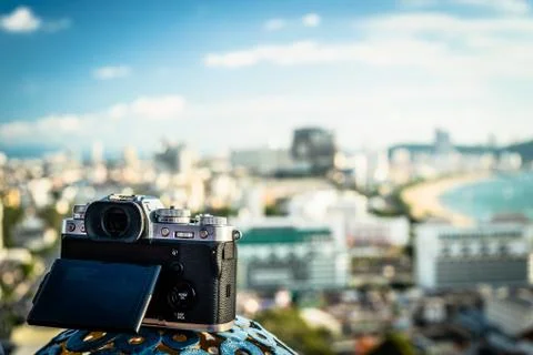 The camera stands near the panoramic window with a beautiful panoramic view Stock Photos
