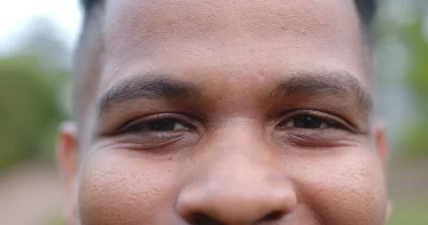 On camera start man is opening eyes slowly and lifting mouth corners into faint Stock Footage 345270516