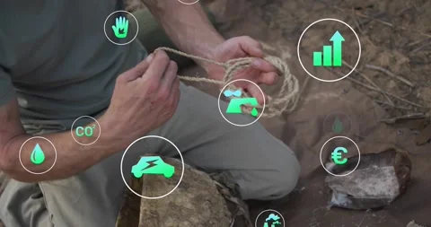 Camera starting kneeling man braiding rope pulling loops tight showing camp knot Stock Footage 334038033