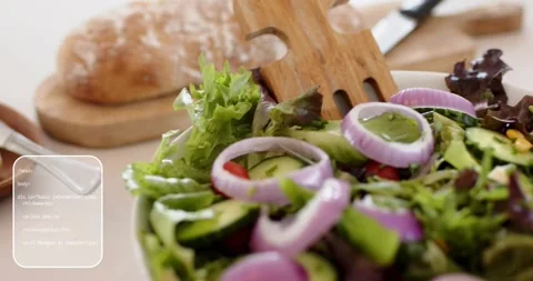 Camera starting, salad filling frame, UI panels overlaying showing produce for Stock Footage 321734252