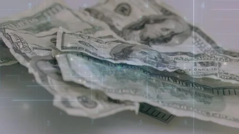 Camera starting top sweep, shifting, tilting, revealing US dollar stack, HUD Stock Footage 329454430