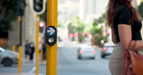 Camera staying locked on yellow pole at crosswalk as lights switching to red, 動画素材 344645145