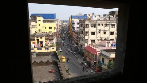 Camera Steps Out of Window to Reveal Indian City at Golden Hour Stock Footage 129109640