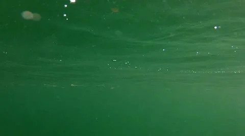 Camera submerged below water at beach Stock Footage 11710265